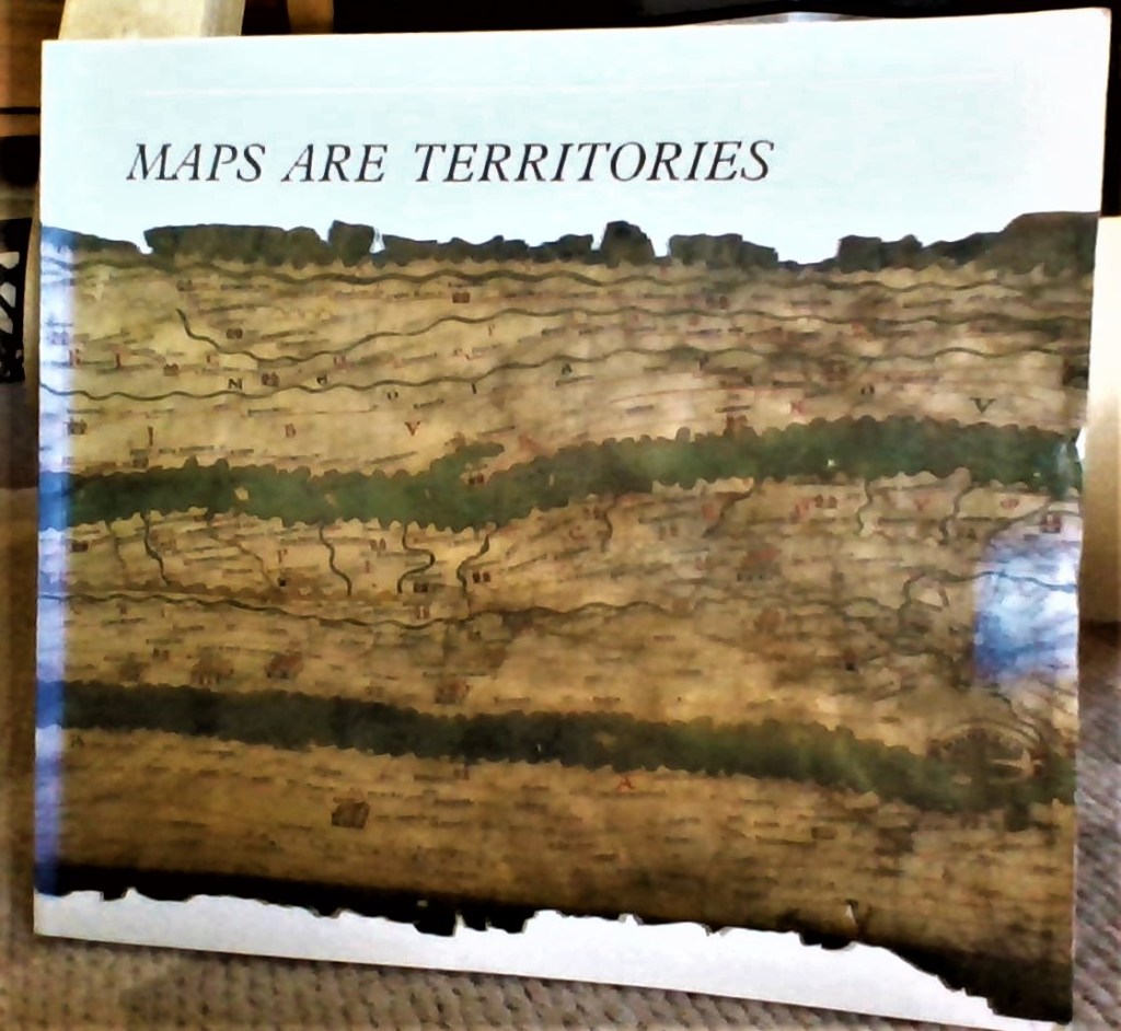 A book cover with the title "Maps Are Territories"